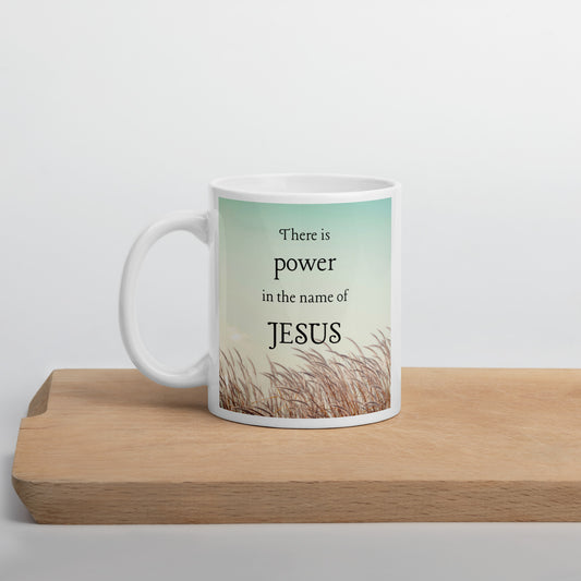 There is power in the name of Jesus White glossy mug