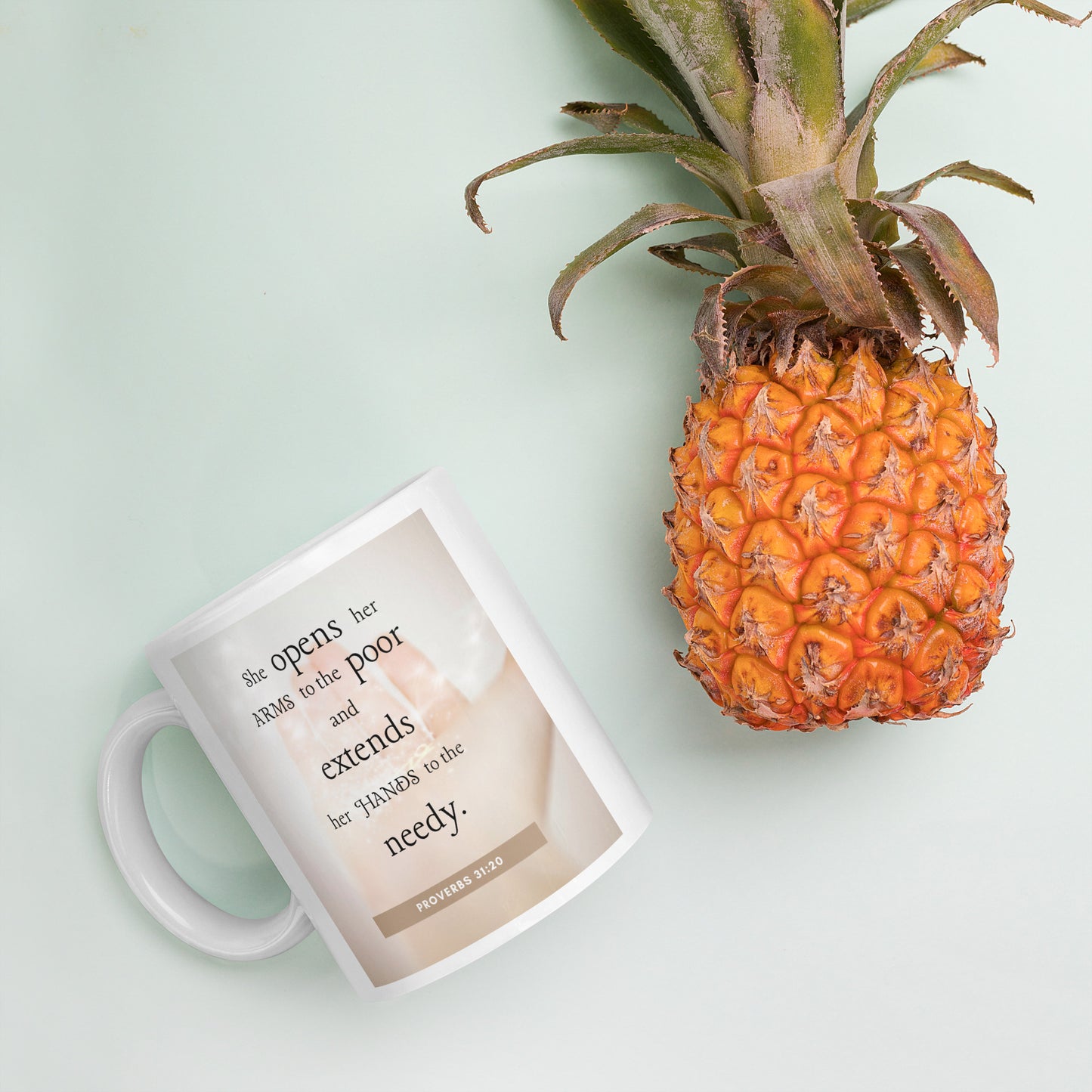 Proverbs 31:20 White glossy mug