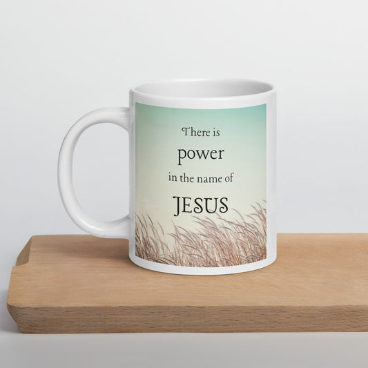 There is power in the name of Jesus White glossy mug